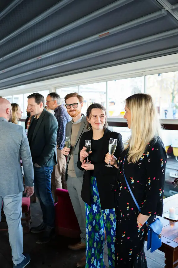Guests networking with drinks at an evening reception